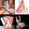 Imagen de Espejo de maquillaje con luz led y set de brochas 360º